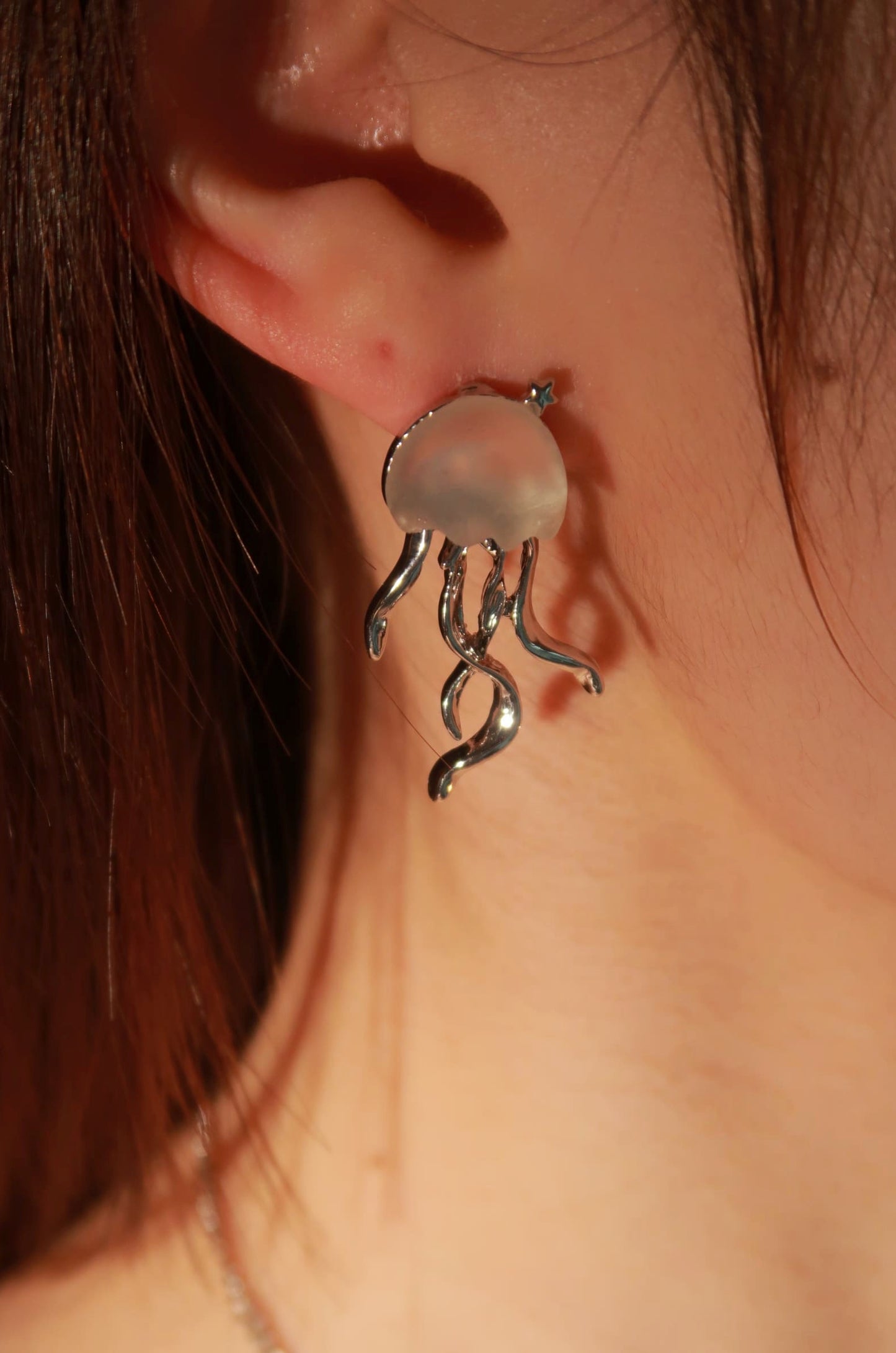 wearing jellyfish earring